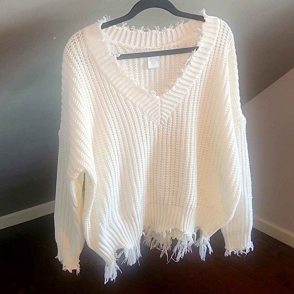 Cream colored lightweight sweater.